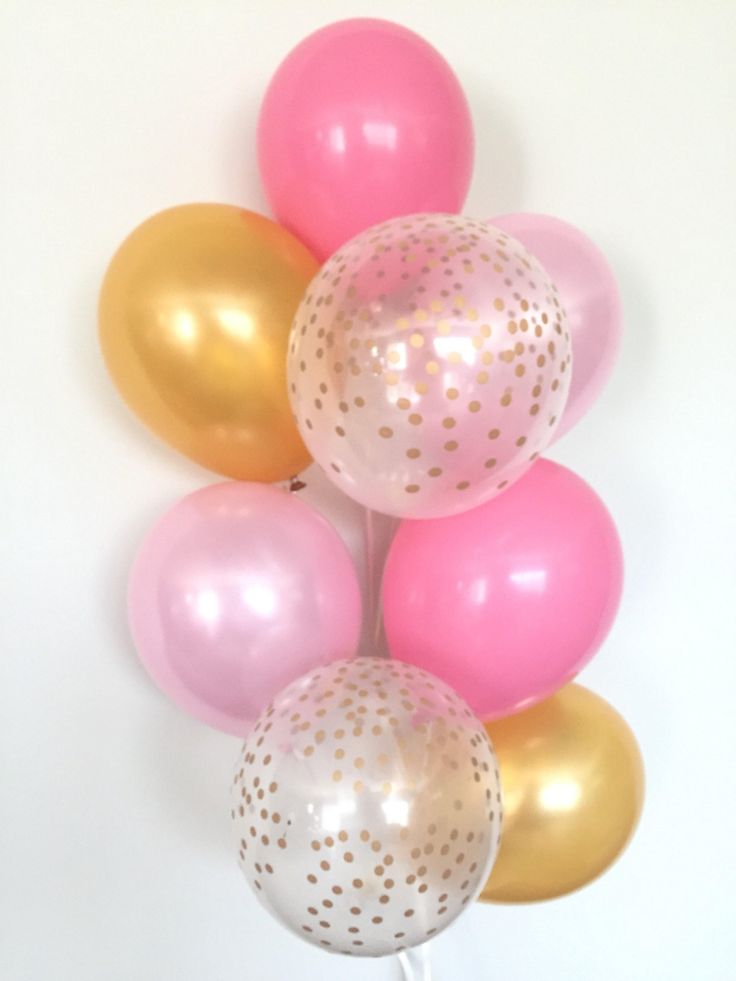 pink, gold and white balloons with polka dots on them