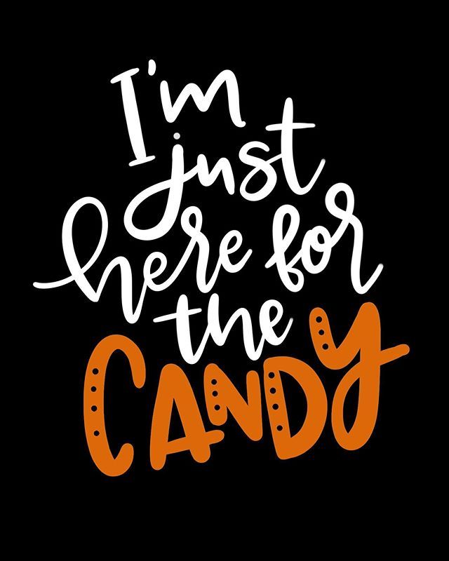 the words i'm just here for the candy are written in orange and white