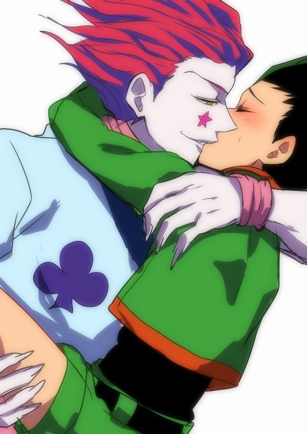 two people are hugging each other while one person has pink hair and is wearing a green shirt