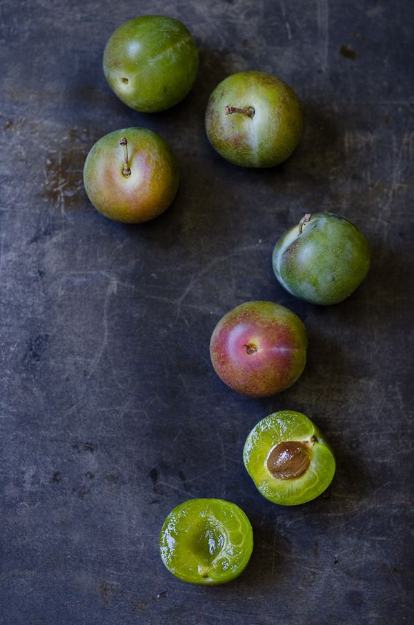 some green and red fruit on a table