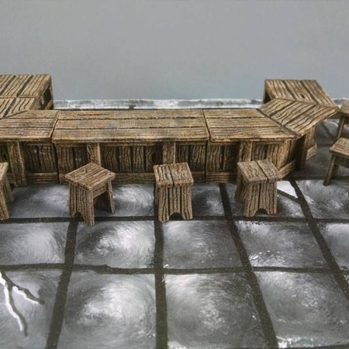 a table and chairs made out of wickers on top of ice covered ground