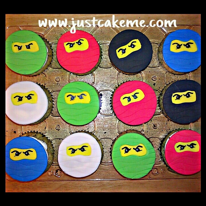 cupcakes decorated with the faces of ninja turtles