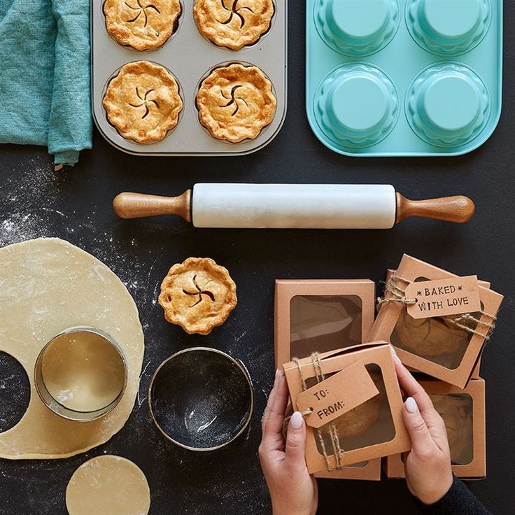 an overhead view of pies and baking supplies on a table with doughnut holes