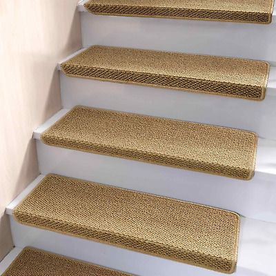 a set of beige carpeted stairs leading up to the second floor in a home