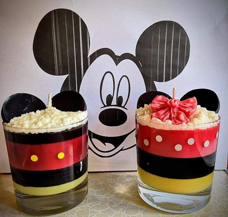 two mickey mouse desserts sitting next to each other