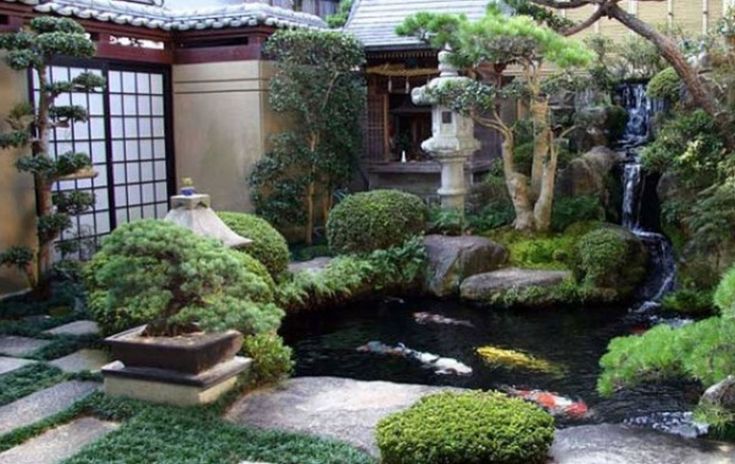 a japanese garden with koi fish in the pond