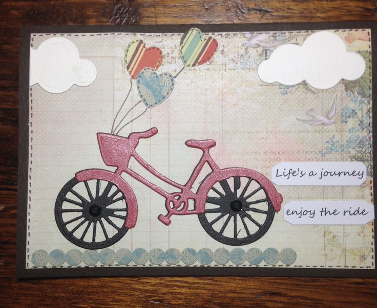 a card with a bicycle and balloons on it