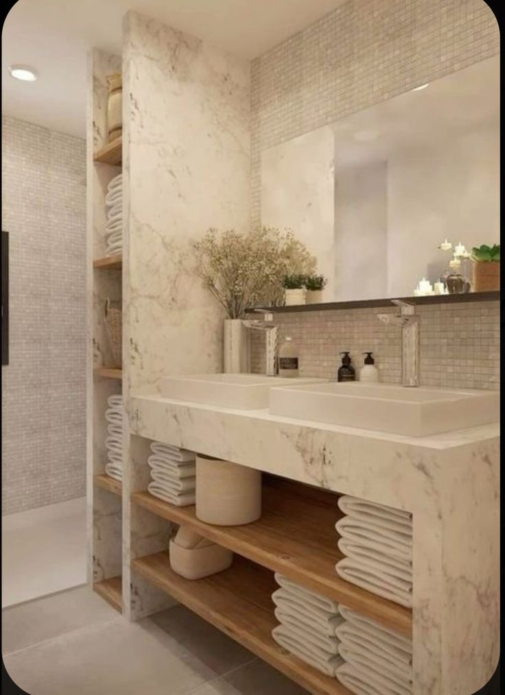 a bathroom with marble counter tops and shelves