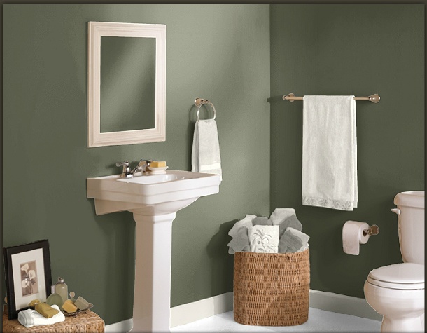 a bathroom with blue walls and white fixtures