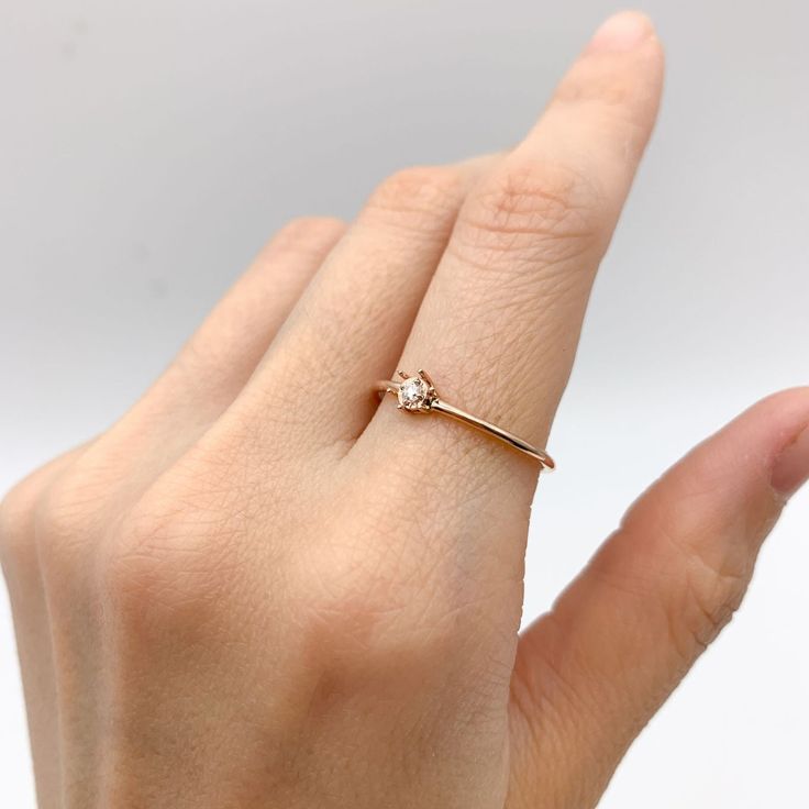 Dainty Diamond Rose Gold Ring set with Natural Diamond, size 2 millimeters diameter, 0.6 Carats.Solid 14k Rose Gold ☞ made to last.Click here for ☞ Solid Gold CollectionDiamond Details:• CERTIFIED Natural Diamond• Weight: 0.6 Carats• Dimensions: 2mm• Color: G• Clarity: I1• Cut: Very GoodSolid Gold Details:• 1 gram of 14k Solid Rose Gold• Dimensions: Band width ≈ 1mm, thickness ≈ 1mm• Lasts a lifetime - Perfect for everyday use (won’t tarnish)!*Final weight & dimensions depending on the chosen ri 14k Rose Gold Stackable Promise Rings, 14k Rose Gold Stackable Rings With Brilliant Cut, 14k Gold Rose Flower Ring Gift, 14k Rose Gold Midi Rings With Round Band, Yellow Gold Flower Ring With Single Diamond For Promise, Rose Gold Stackable Rings With Brilliant Cut, Rose Gold Diamond Ring With Rose Cut Open Ring, Rose Gold Jewelry With Single Diamond Round Band, Rose Gold Diamond Ring With Rose Cut Open Design