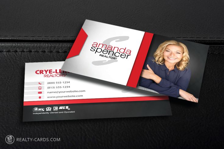 a black and red business card with a woman's face on it, next to a briefcase