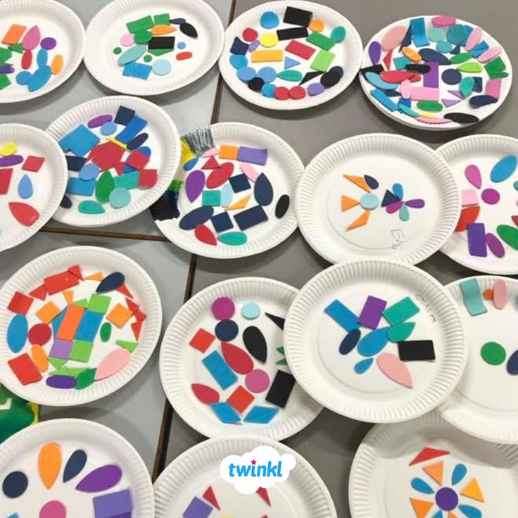 paper plates with colorful designs on them are arranged in the shape of letters and numbers