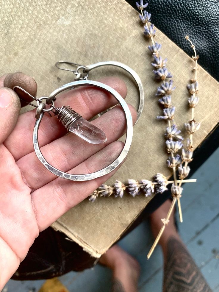 "I created these fierce hoops out of oxidized sterling silver that I hammered into 2\" hoops ... I then added 20g sterling silver earwires to accent the quartz points that have been carefully wire-wrapped and suspended... Also available in copper: http://etsy.me/15lJJdV ** listing is for ONE pair of hoops** * Thank you for looking PLEASE NOTE: ** For sanitary and hygienic reasons, all earring sales are FINAL. ALL unauthorized returns will be subject to a 25% restock fee. Every item comes careful Everyday Small Hoop Earrings With Oxidized Finish, Everyday Oxidized Finish Dangle Earrings, Unique Hand Forged Sterling Silver Hoop Earrings, Oxidized Finish Hoop Earrings For Gifts, Unique Small Hoop Jewelry With Oxidized Finish, Oxidized Finish Hoop Earrings As Gift, Oxidized Round Hoop Earrings As Gift, Gift Hoop Earrings With Oxidized Finish, Unique Nickel-free Hoop Earrings For Everyday