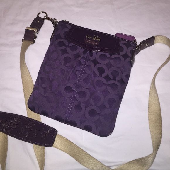 Purple cross body Coach bag Purple cloth cross body Coach bag in traditional C print. With silver and patent leather detailing Coach Bags Crossbody Bags Purple Cloth, Crossbody Coach, Purple Cross, Body Coach, Leather Detailing, Coach Crossbody Bag, Purple Bags, Coach Bag, Coach Bags