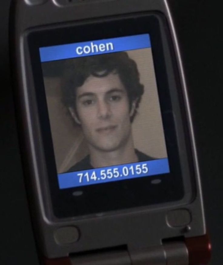 a cell phone with an image of a man on it's screen and the text, cohen