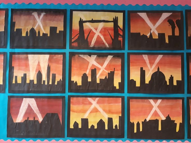 the cityscape is painted with different colors and shapes, including letters that spell out x