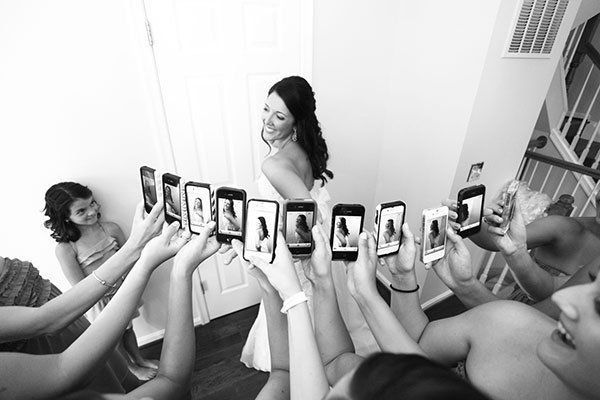 a group of women holding up cell phones in front of them with the caption best wedding photos share