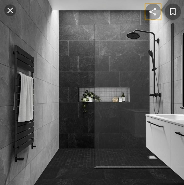 a black and white photo of a bathroom with shower, sink, and towel rack