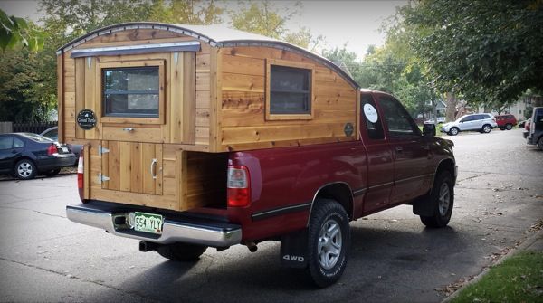 a truck with a camper attached to the back