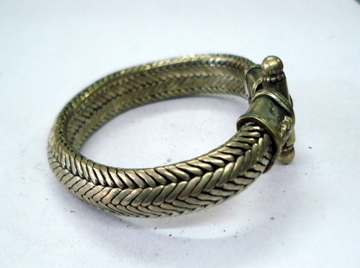 VINTAGE SILVER ROPE CHAIN BRACELET FROM RAJASTHAN INDIA, GREAT HANDMADE SNAKE DESIGN BRACELET, GOOD FOR JEWELLERY COLLECTION. Note - Please check pictures care fully for more detail. length - 20.5 cm(8 inch) we can adjust the length. width - 13 mm weight - 114 grams material - silver. Heavy Adjustable Metal Bracelet, Nickel-free Traditional Bangle Jewelry, Vintage Snake Jewelry For Gifts, Vintage Snake-shaped Jewelry Gift, Bohemian Silver Braided Bangle Bracelet, Silver Bohemian Braided Bangle Bracelet, Handmade Antique Silver Bracelets For Festivals, Silver Brass Bracelet, Handmade Metal Bracelets For Ceremonial Occasions