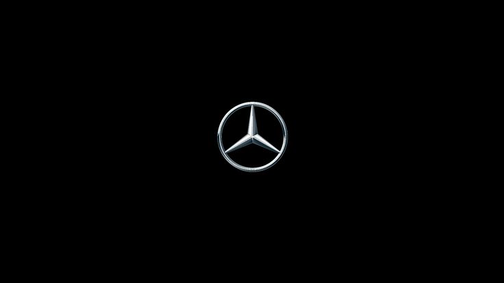 the mercedes logo is shown on a black background in this image, it appears to be dark