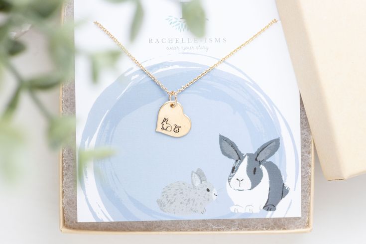 This Bunny necklace is perfect for a birthday gift or Christmas gift for Mom. G O L D ∙ B U N N Y ∙ H E A R T ∙ N E C K L A C E * Materials:  Aluminum - Hypoallergenic aluminum charm with non-tarnishing rhodium-plated chain Gold - Gold-filled charm with non-tarnishing gold-plated chain Sterling - Solid sterling charm with non-tarnishing rhodium-plated chain * Dimensions: 1/2 inch heart charm * Dainty Chain - You choose the length * Personalized: Ask me how I can add more baby bunnies to this des Cute Birthday Pendant Jewelry, Handmade Heart-shaped Name Necklace For Gift, Personalized Necklace For Birthday And Valentine's Day, Birthday Gift Necklace With Hallmark, Pendant Necklace For Birthday And Valentine's Day, Pendant Necklaces For Birthday Gift, Meaningful Jewelry For Birthday Gifts, Birthday And Valentine's Day Pendant Necklace, Handmade Charm Necklace For Birthday And Mother's Day