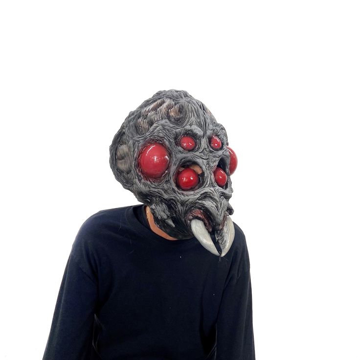 This supersized arachnoid alien mask has alien eyes and fangs for great scare factor, The mask is constructed with a foam insert for height and comfort and bone like spider-like features! This spider mask has a great alien look but also resembles a spider face in a full overhead latex mask. This mask utilizes a foam insert to help keep the wearer comfortable and prevent the mask from shifting on the wearer's head. Hand-poured, painted, and assembled in the USA. This Halloween mask can be used co Horror Skull Mask For Cosplay, Spooky Mask For Cosplay, Sci-fi Black Masks And Prosthetics For Halloween, Futuristic Full Face Mask For Halloween, Futuristic Masks And Prosthetics For Halloween, Futuristic Halloween Costume Masks And Prosthetics, Futuristic Masks And Prosthetics For Halloween Masquerade, Futuristic Masks And Prosthetics For Halloween Costume Party, Monster Spider