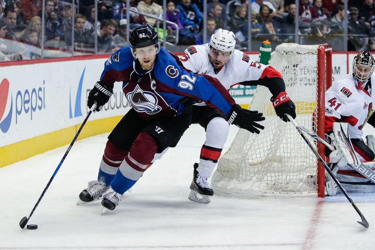 two hockey players in action on the ice