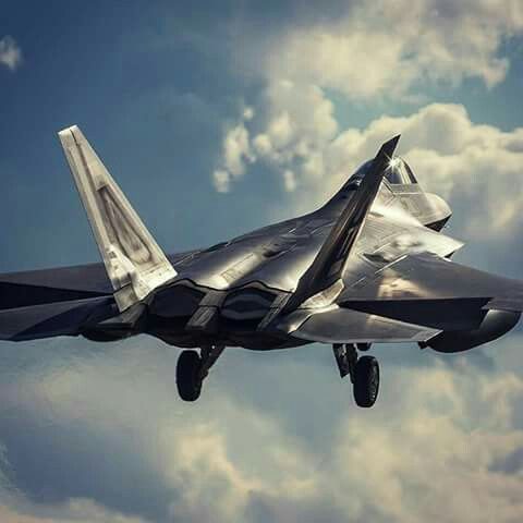 a fighter jet flying through the sky with clouds in the backgrounds