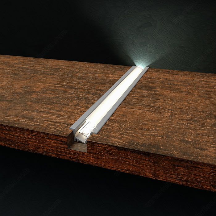 a wooden table with a light shining on it's side and the end section