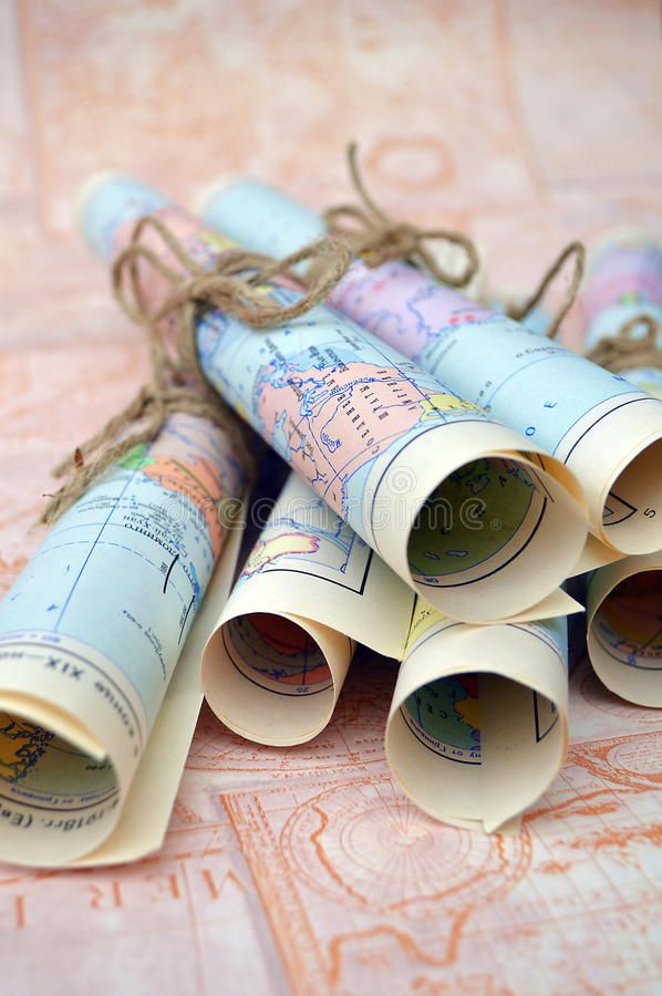 several rolled up maps on a table with twine of twine royalty images and stock photos