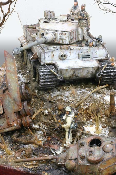 an old tank is sitting on top of a pile of debris and other items in the foreground