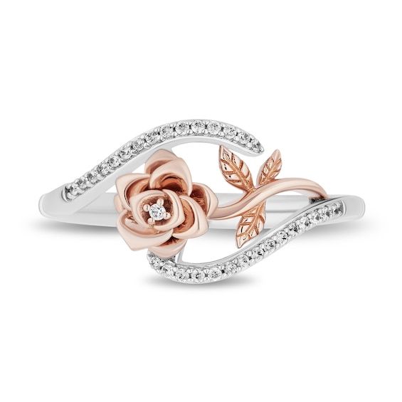 Enjoy the whimsical yet romantic design of this diamond bypass rose ring from the Enchanted Disney Fine Jewelry Collection inspired by Belle. Crafted in sterling silver A 10K rose gold flower sparkles with a single diamond inside the bloom. Bypassing ribbons of shimmering diamonds highlight the sideways centrepiece. This ring captivates with 1/10 ct. t.w. of diamonds. ©Disney Belle Rings, Lotus Flower Engagement Ring, Disney Wedding Rings, Princess Wedding Rings, Disney Engagement Rings, Wattpad Ideas, Disney Rings, Unique Engagement Rings Rose Gold, Rose Gold Bridal Set