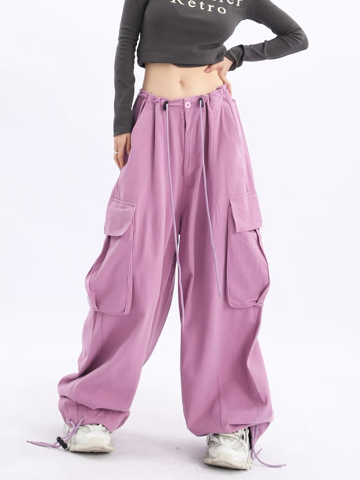 Step out in style with our Acubi Wide Leg Baggy Track Pants. These Y2K-inspired streetwear essentials feature a relaxed fit, drawstring waist, and plenty of pockets, ensuring a comfortable and trendy look. Trendy Baggy Bottoms With Pockets, Streetwear Harem Pants With Cargo Pockets And Straight Leg, Streetwear Straight Leg Harem Pants With Cargo Pockets, Streetwear Straight-leg Harem Pants With Cargo Pockets, Streetwear Harem Pants With Pockets, Baggy Bottoms For Outdoor Activities, Relaxed Fit Wide-leg Utility Cargo Pants, Baggy Sweatpants With Pockets For Outdoor Activities, Trendy Baggy Bottoms With Multiple Pockets