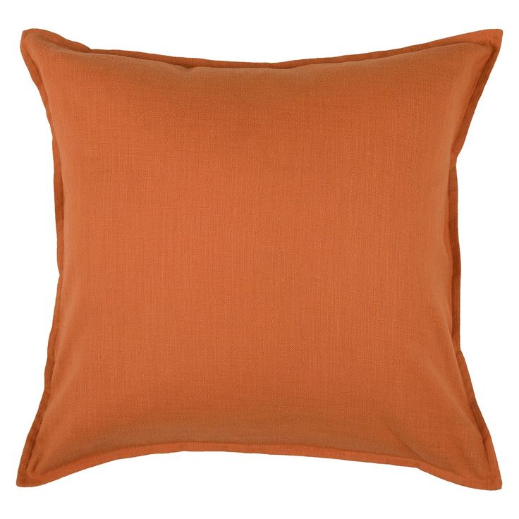 an orange pillow on a white background