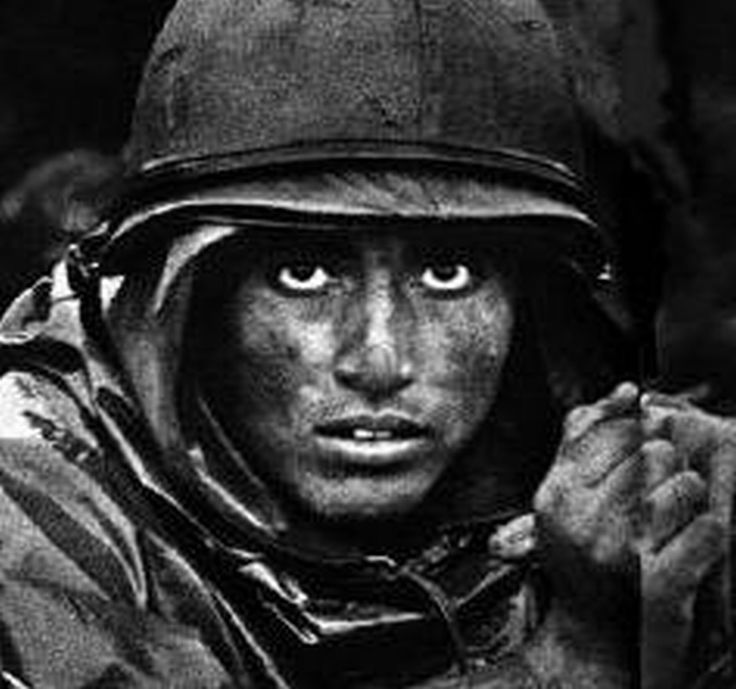 a black and white photo of a soldier