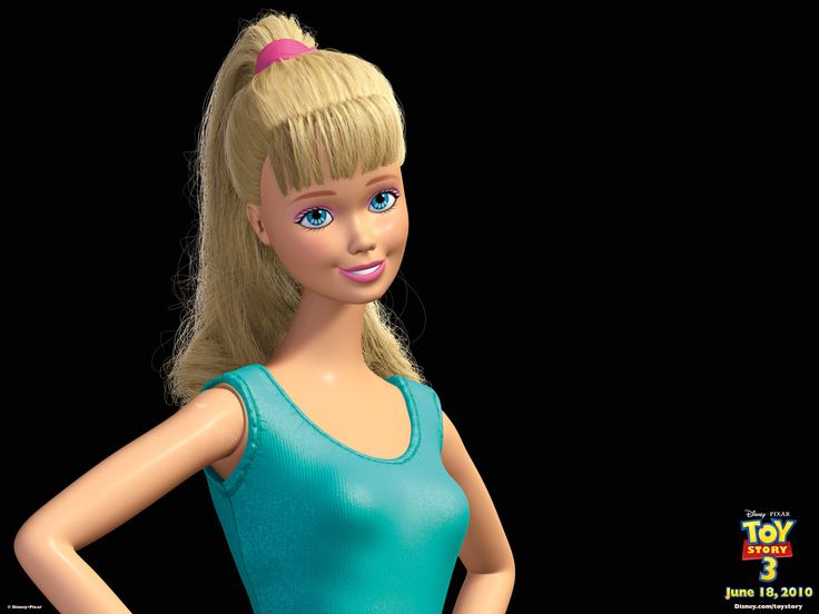 a barbie doll with blonde hair wearing a blue top