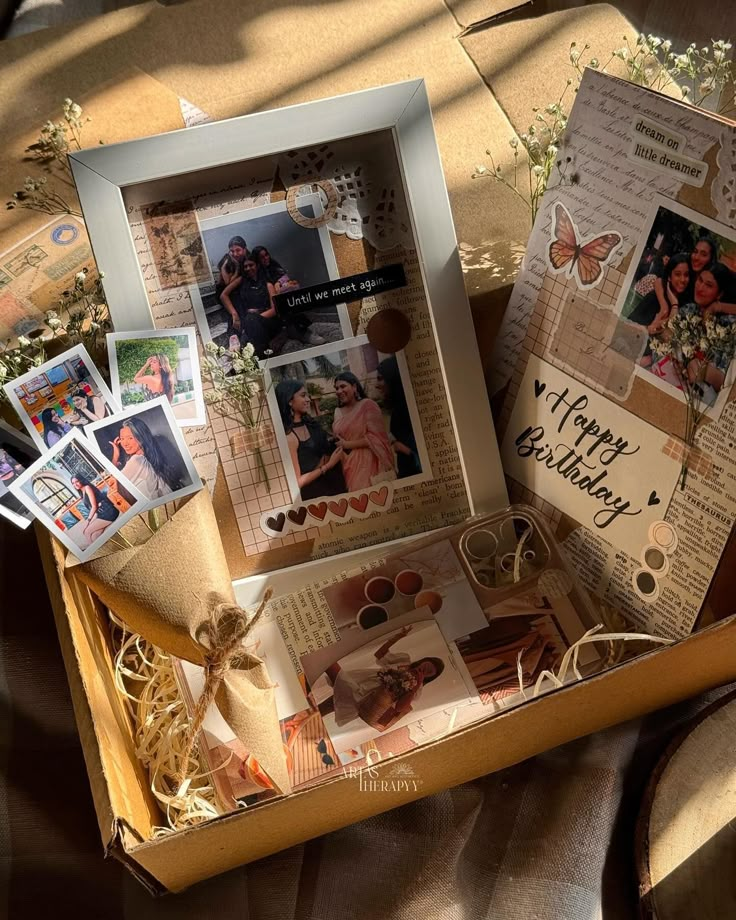 an open box filled with pictures and cards