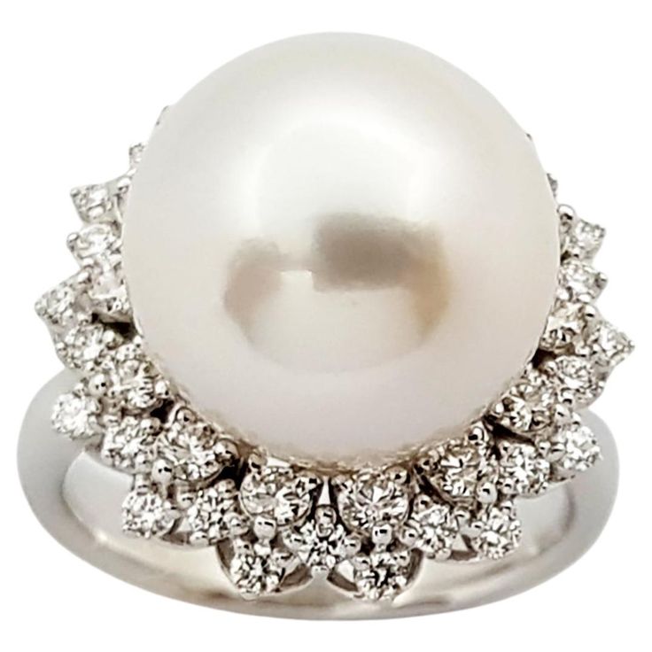 South Sea Pearl with Diamond 0.38 carat Ring set in 18 Karat White Gold Settings Width: 1.8 cm Length: 1.8 cm Ring Size: 51 Total Weight: 8.92 grams South Sea Pearl: 12.6 mm "We first opened doors in 1980 when it was then situated in the vicinity of the Victory Monument; a small and modest storefront with a couple of counters. From its humble beginnings to where it stands today, our company has proven its abilities as a jeweler. Since the beginning, we have been supplying fine quality pieces to Timeless White Gold Pearl Ring With Diamonds, Formal Diamond White Pearl Ring With Diamond Accents, Fine Jewelry White Gold Pearl Ring With Prong Setting, White Gold Pearl Ring With Prong Setting, Timeless Diamond Pearl Ring With Prong Setting, Classic Brilliant Cut Diamond White Pearl Ring, Fine Jewelry White Gold Pearl Ring With Brilliant Cut, Exquisite Diamond Pearl Ring With Prong Setting, Luxury Pear-shaped White Gold Diamond Ring