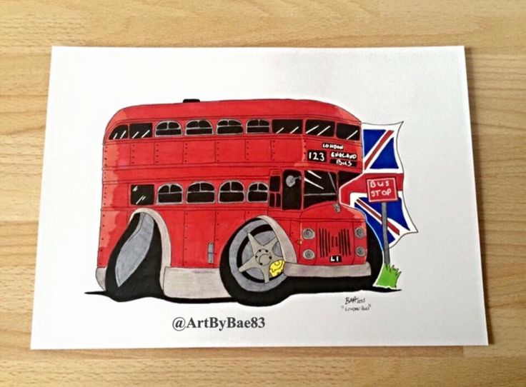 a drawing of a red double decker bus on a wooden surface with the british flag in the background