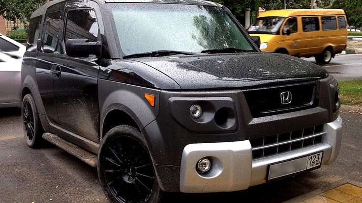 a black and silver vehicle parked on the street