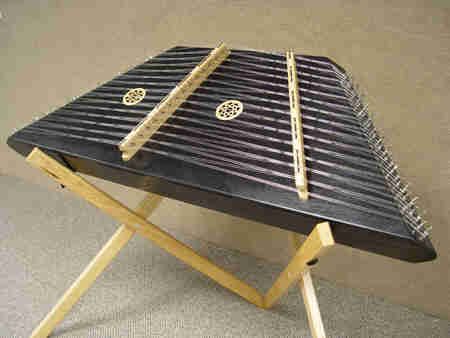 an instrument sitting on top of a wooden stand