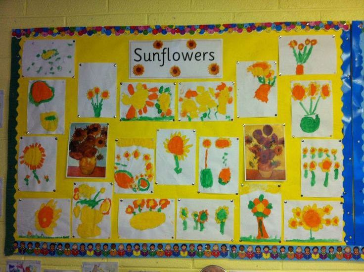 a child's room with sunflowers painted on the wall and stuffed animals