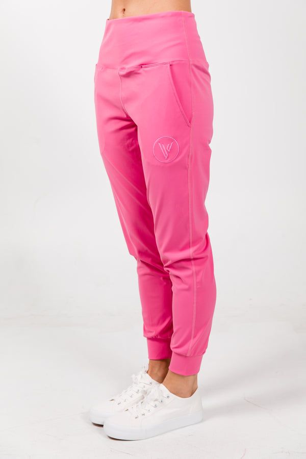 Description Our comfiest jogger yet for all of our sports. Made in a silky light material with bold colors and design to make your outfits pop anywhere you go. Great for the range, courts, or just running errands. So comfy you won't want to take it off. Available in pink, iced aqua, and beige. Detail Lightweight UV protection Dri-fit High waisted Side pockets Imported 85% Polyester / 15% Spandex FIT Regular Fit Trendy Sports Sweatpants With Elastic Waistband, Sporty Pink Sweatpants With Ribbed Waistband, Sporty Workout Bottoms With Elastic Cuffs, Comfort Stretch Joggers With Elastic Side Panels, Sporty Pink Joggers With Elastic Cuffs, Nylon Relaxed Fit Sweatpants For Athleisure, Sporty Joggers With Elastic Waistband And Comfort Stretch, Casual Activewear With Ribbed Waistband For Running, Casual Activewear For Running With Ribbed Waistband