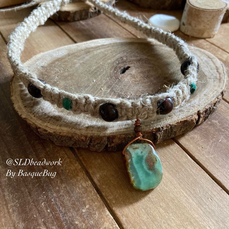 Green Chrysoprase necklace hemp malachite necklace choker boho hippie necklace tribal stone festival necklace unique jewelry for men women This beauty has a energy green chrysoprase gemstone, semi rough and so pure, wire wrap in copper, 8mm malachite gemstone beads, 8mm wood beads, It's awesome. Beautiful handmade hand woven hemp in a straight and delicate pattern It's 16 inches and a tie on so could go 18 or 20 inches too. Depending on how you like to wear it.  Can't find your stone or color? I specialize in hard to find unique stones, beads and peyote beadwork. Check out my Etsy store & search for more great SLD unique earrings. www.Etsy.com/shop/sldbeadwork Find me on IG, Pinterest and FB @SLDbeadwork I do fun giveaways! Artisan Jewelry With Adjustable Cord For Meditation, Spiritual Style Choker Necklace With Adjustable Cord, Wire Wrapped Choker For Festivals, Artisan Necklace With Adjustable Cord For Healing, Wire Wrapped Choker For Festival, Artisan Adjustable Hand Wrapped Beaded Necklaces, Handmade Earthy Turquoise Necklace For Gift, Bohemian Wire Wrapped Crystal Necklaces, Festival Wire Wrapped Choker Jewelry