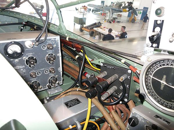 an airplane cockpit with gauges and other equipment on the table in front of it