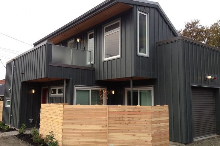 two story house with wood slats on the front