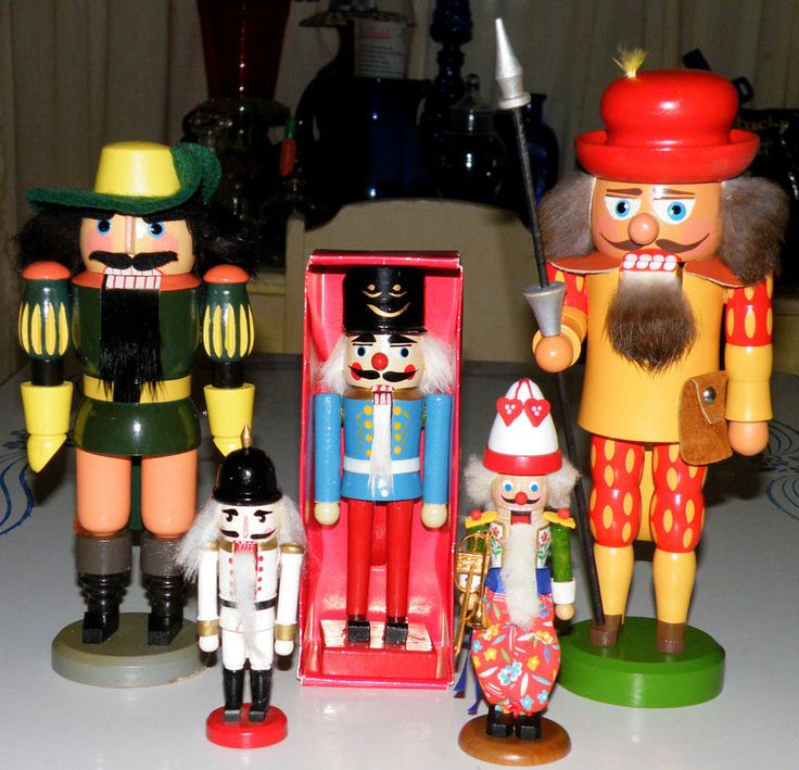 three nutcrackers are standing next to each other