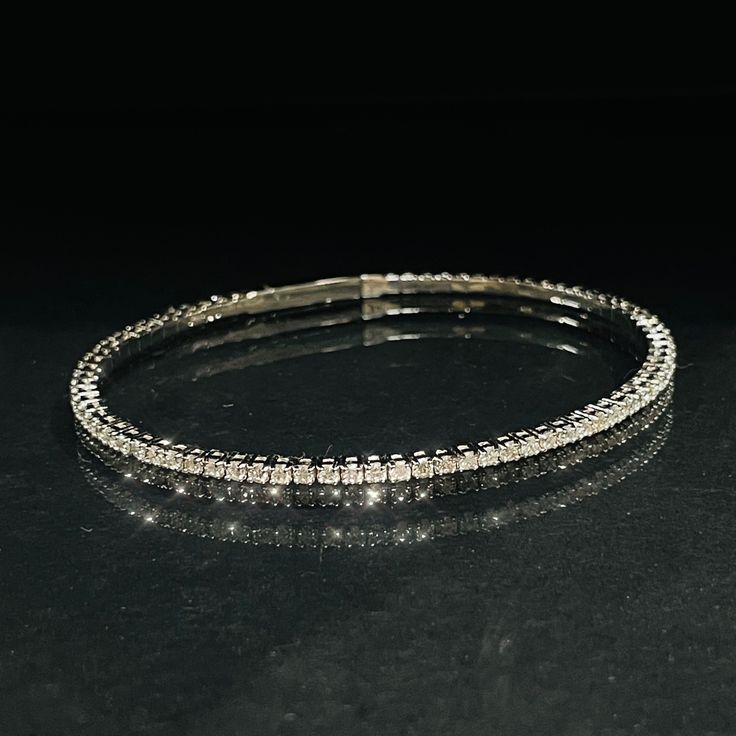 "Natural earth mined 75 diamonds .025 carats each The diamonds are G-H color SI1 to I1 clarity   Snap closure Sits for 6.75\" Made in 14K white gold  Weight 7.6 grams" Diamond White Brilliant Cut Diamond Bracelet, Fine Jewelry Diamond White Bracelet With Brilliant Cut, Formal White Gold Diamond Chain Bracelet, Diamond White Tennis Bracelet With Single Cut Diamonds, White Gold Brilliant Cut Diamond Bracelet, Flexible Diamond White Cubic Zirconia Tennis Bracelet, Fine Jewelry Diamond Bracelet In Diamond White, White Gold Tennis Bracelet With Diamond Accents, Dazzling White Gold Bracelets With Diamond Accents