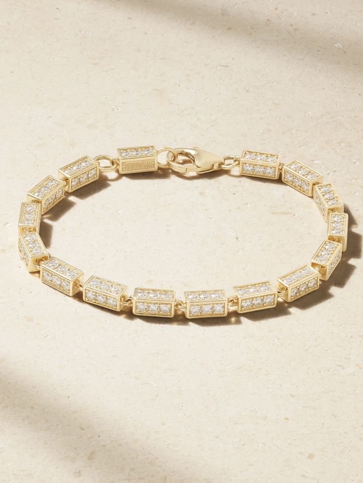 Suzanne Kalan believes in the timeless beauty of fine jewelry and dedicates every effort to ensuring each piece moves confidently through the years with you. This bracelet has been handcrafted in LA from 18-karat gold and has rectangular channels set with sparkling diamonds that are visible from all sides, so you never have to worry about how it falls on the wrist. Luxury Pave Setting Chain Bracelet For Anniversary, Luxury Chain Bracelet With Pave Setting For Anniversary, Polished Yellow Gold Diamond Bracelet, Yellow Gold Diamond Bracelet With Polished Finish, Luxury Diamond Yellow Gold Chain Bracelet, Elegant 14k Gold Bracelets With Pave Setting, Luxury Yellow Gold Cubic Zirconia Chain Bracelet, Luxury Yellow Gold Chain Bracelet With Cubic Zirconia, Luxury Diamond Jewelry With Rectangular Links